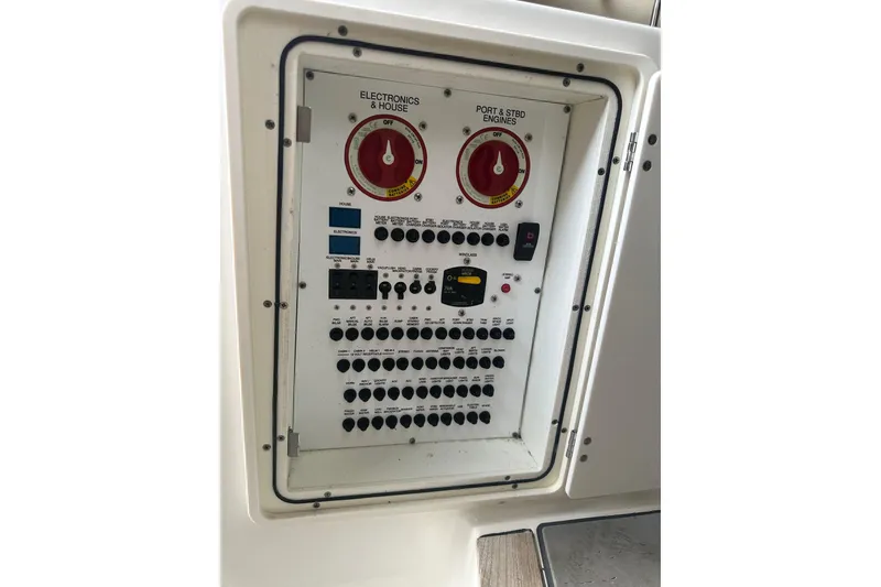 Slide: The Image of Electrical control panel on a 2020 Pursuit OS 325 Offshore boat. - 16