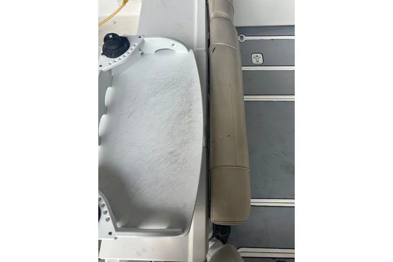 Slide: The Image of 2020 Pursuit OS 325 Offshore boat interior with seating and storage area. - 29