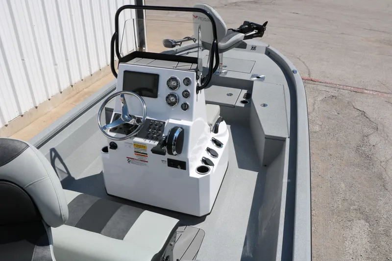 Slide: The Image of 2025 Vexus ACX 2000 boat interior with steering console and seating. - 15