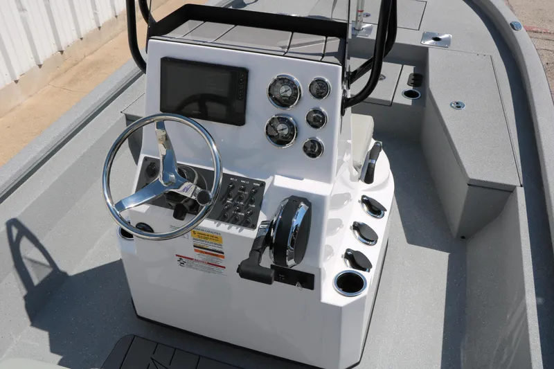Slide: The Image of 2025 Vexus ACX 2000 boat console with steering wheel and control panel. - 16
