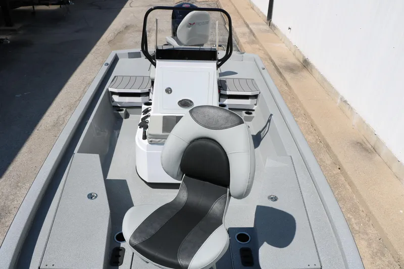 Slide: The Image of 2025 Vexus ACX 2000 boat interior with modern seating and console design. - 18