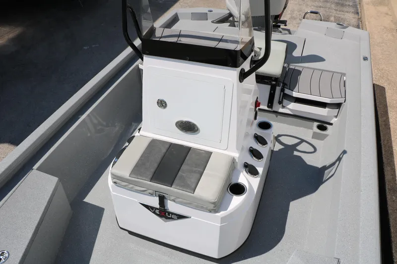 Slide: The Image of 2025 Vexus ACX 2000 boat interior with seating and control console. - 20