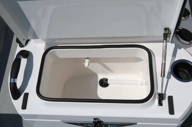 Slide: The Image of Open storage compartment in 2025 Vexus ACX 2000 boat, featuring hydraulic lift support. - 21