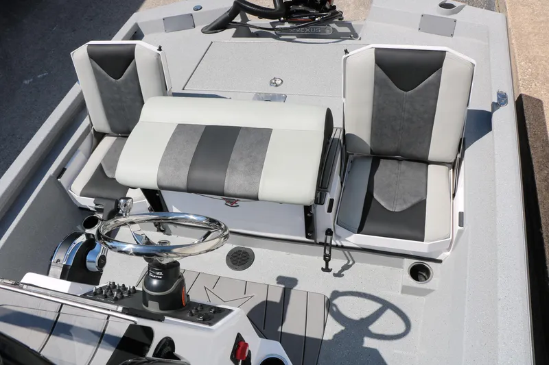 Slide: The Image of 2025 Vexus ACX 2000 boat interior with modern seating and steering wheel. - 23