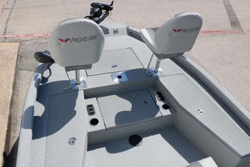 Slide: The Image of 2025 Vexus ACX 2000 boat interior with dual seats and storage compartments. - 24