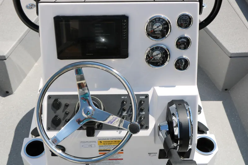 Slide: The Image of Steering console of 2025 Vexus ACX 2000 boat with gauges and controls. - 27