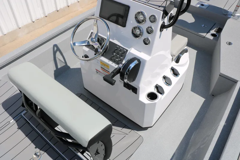 Slide: The Image of 2025 Vexus ACX 2000 boat console with steering wheel and control panel. - 29
