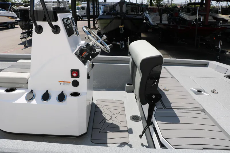 Slide: The Image of 2025 Vexus ACX 2000 boat interior with steering console and seating, showcasing modern design. - 30