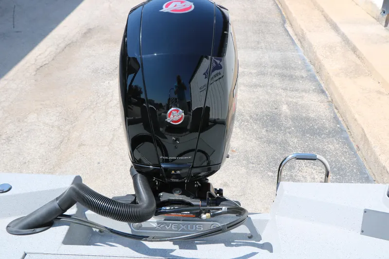 Slide: The Image of 2025 Vexus ACX 2000 boat engine, sleek black design, outdoor setting. - 35