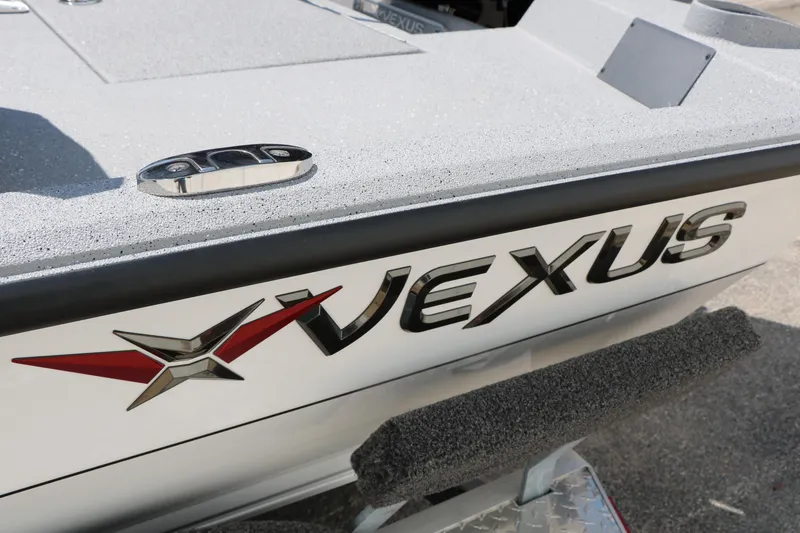 Slide: The Image of 2025 Vexus ACX 2000 boat with sleek design and logo detail. - 36