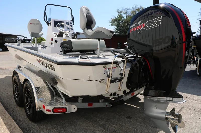 Slide: The Image of 2025 Vexus ACX 2000 boat with Mercury Pro XS engine, dual-axle trailer. - 7