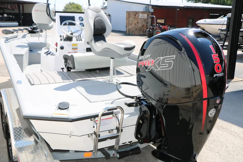 Slide: The Image of 2025 Vexus ACX 2000 boat with Mercury Pro XS 150 engine, docked outdoors. - 8