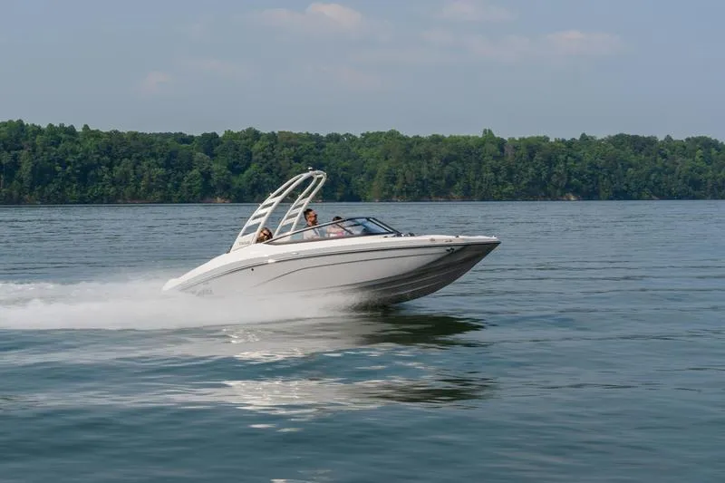 Slide: The Image of 2025 Yamaha Boats 195S speeding on a lake with lush green forest backdrop. - 11