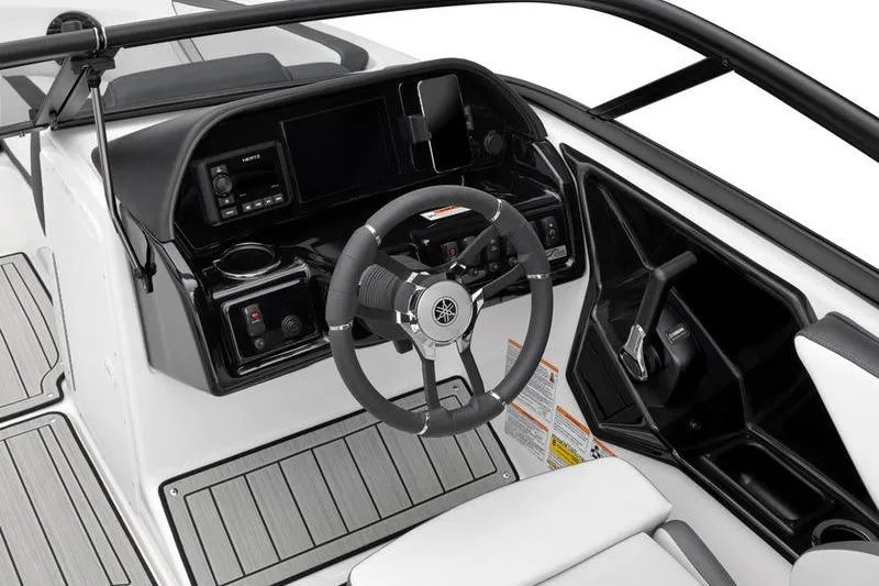 Slide: The Image of 2025 Yamaha Boats 195S cockpit with steering wheel, dashboard, and modern controls. - 2