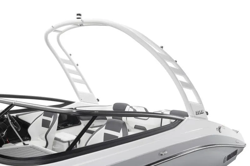 Slide: The Image of 2025 Yamaha Boats 195S, sleek white design with modern seating and arch. - 4