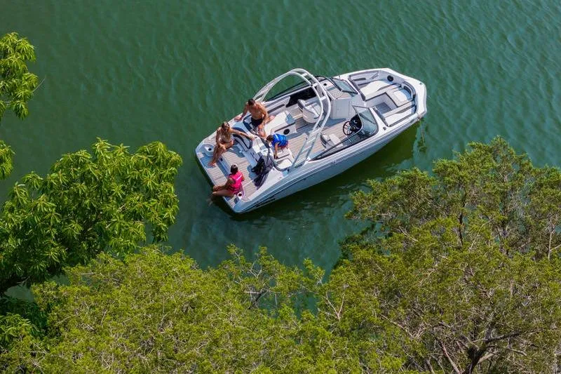 Slide: The Image of 2025 Yamaha Boats 195S on a serene lake, surrounded by lush greenery. - 8
