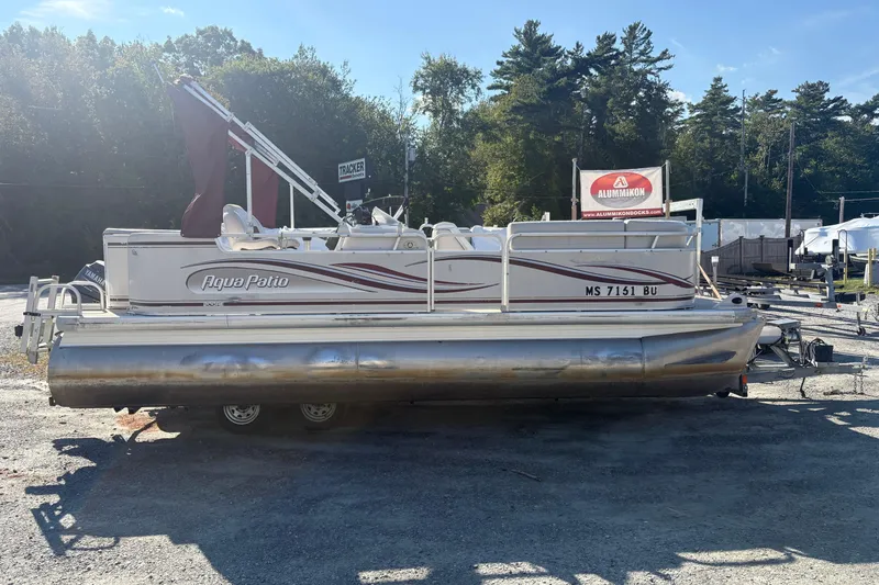 The Image of 2003 Aqua Patio 200RE pontoon boat on trailer in outdoor setting. - 0