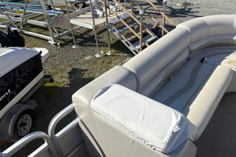 Slide: The Image of 2003 Aqua Patio 200RE pontoon boat with white seating and metal railings. - 4