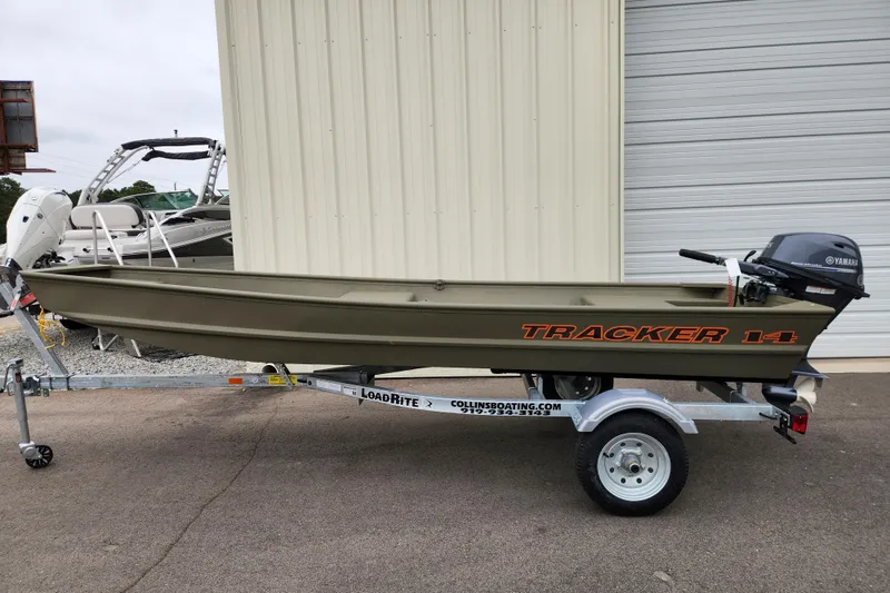 The Image of 2026 Tracker Grizzly 1436 Utility boat on Load Rite trailer, parked outdoors. - 0