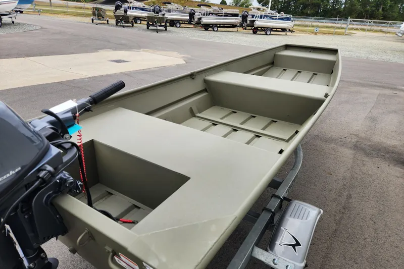 Slide: The Image of 2026 Tracker Grizzly 1436 Utility boat on trailer, featuring a simple, open design. - 5
