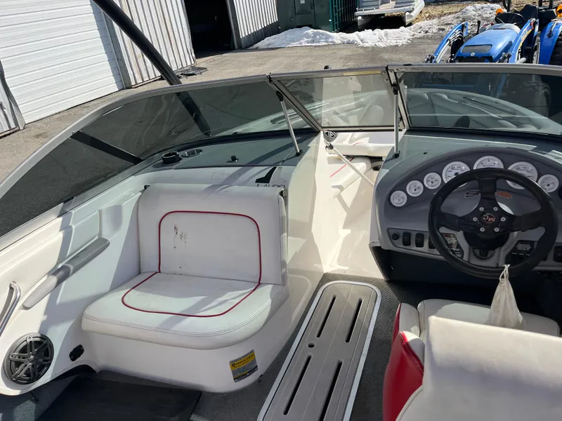Slide: The Image of 1999 MasterCraft XStar boat interior with steering wheel and seating. - 5