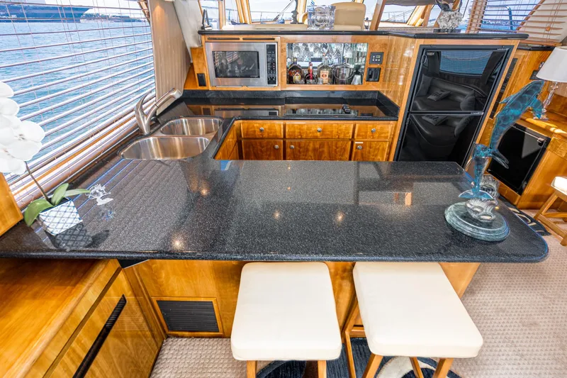 Slide: The Image of Luxurious 2006 Navigator 5100 yacht kitchen with granite countertops and modern appliances. - 10