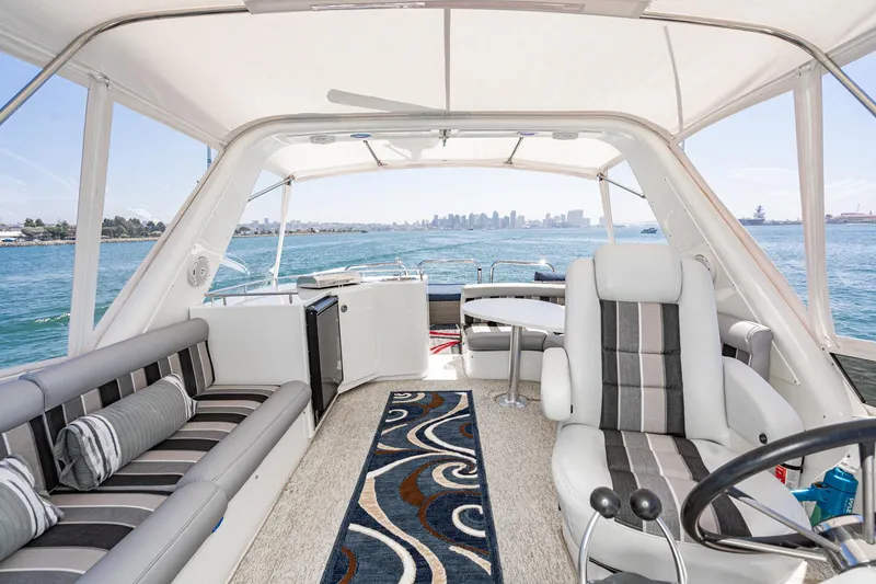 Slide: The Image of Luxurious 2006 Navigator 5100 yacht interior with plush seating and ocean view. - 16