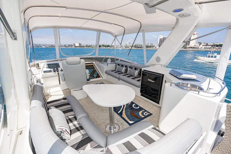 Slide: The Image of Luxurious 2006 Navigator 5100 yacht interior with seating, table, and ocean view. - 19