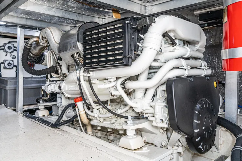 Slide: The Image of Engine room of 2006 Navigator 5100 yacht, showcasing complex machinery and components. - 26