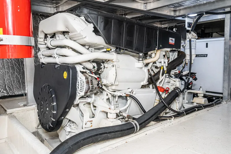 Slide: The Image of Engine room of 2006 Navigator 5100 yacht with visible machinery and components. - 27