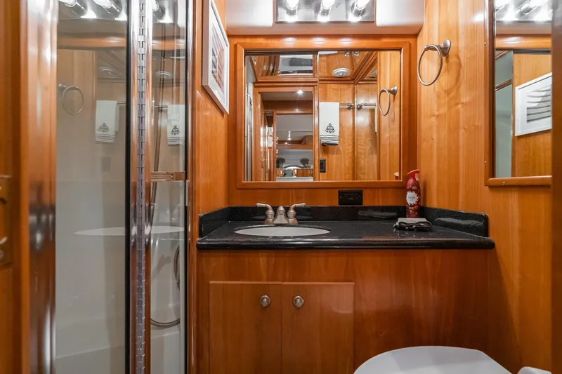 Slide: The Image of Luxurious 2006 Navigator 5100 yacht bathroom with wood paneling and modern fixtures. - 43