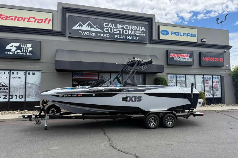 The Image of 2023 Axis A24 boat on trailer outside California Custom Trailers and Powersports dealership. - 0
