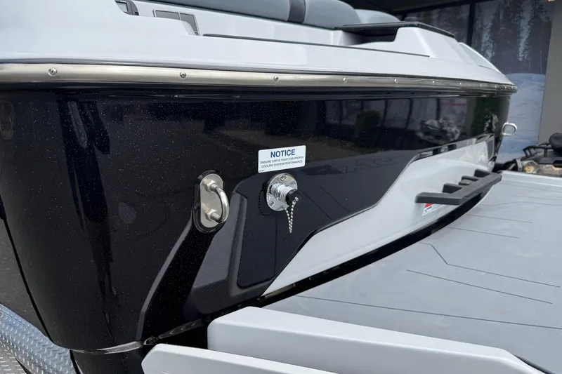 Slide: The Image of 2023 Axis A24 boat rear view with sleek black and white design. - 7