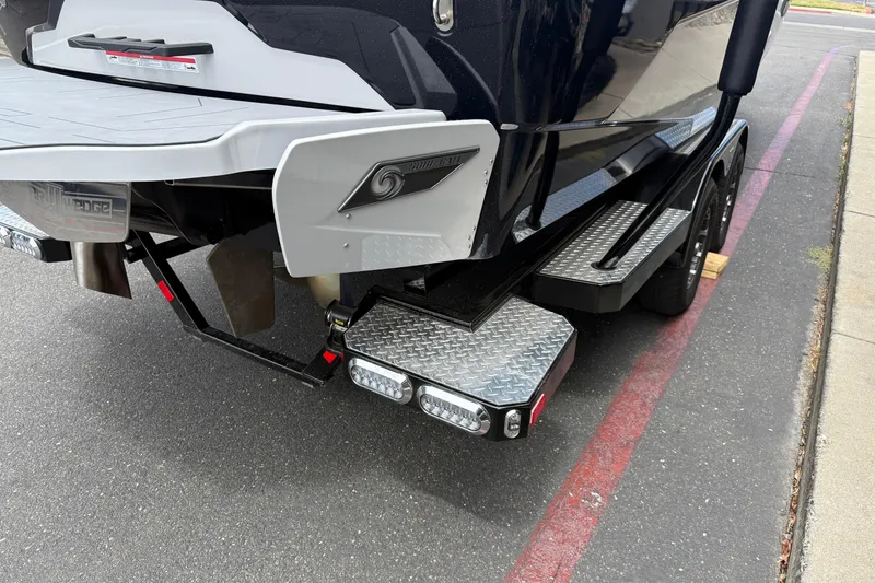 Slide: The Image of 2023 Axis A24 boat trailer with diamond plate steps and LED lights. - 8