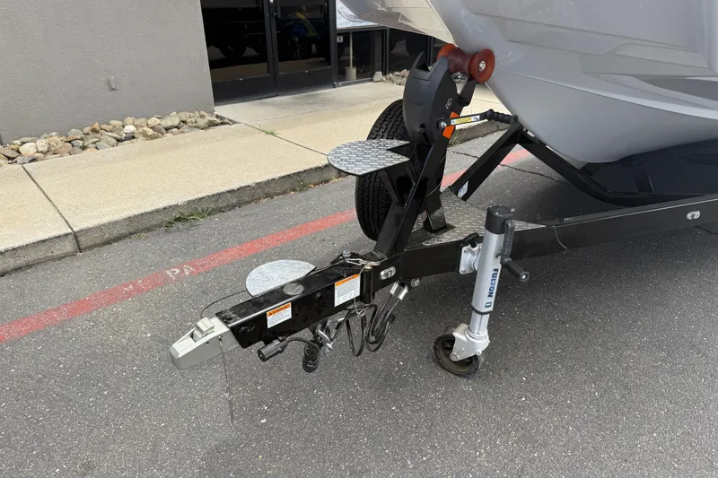 Slide: The Image of 2023 Axis A24 boat trailer hitch and jack on pavement. - 9