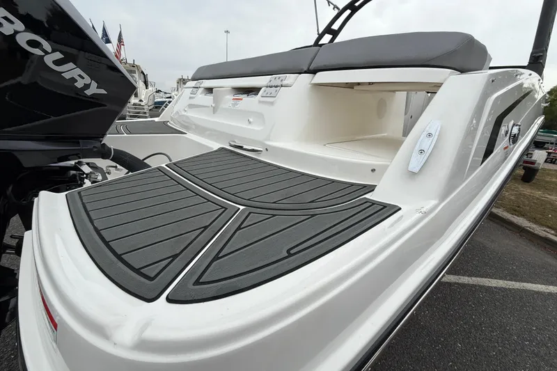 Slide: The Image of 2026 Bayliner VR6 Bowrider OB with sleek deck design and powerful Mercury outboard engine. - 3