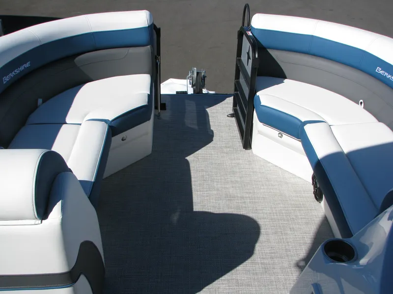 Slide: The Image of 2023 Berkshire 24RFX CTS pontoon boat interior with white and blue seating. - 10