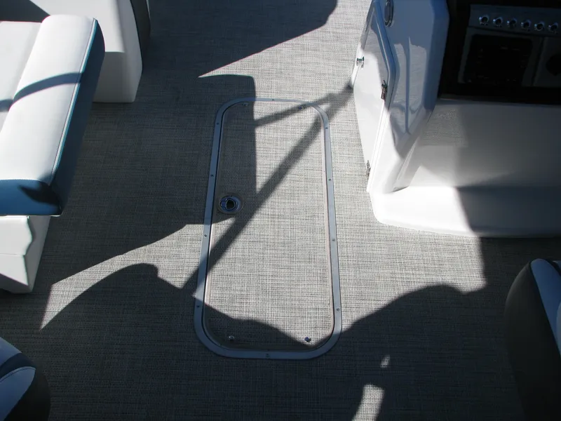 Slide: The Image of 2023 Berkshire 24RFX CTS boat interior with gray flooring and seating. - 11