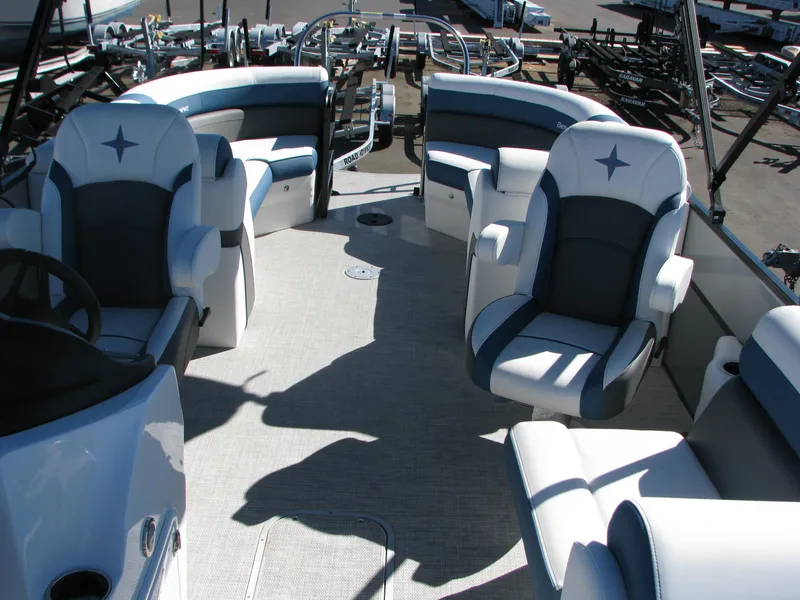 Slide: The Image of 2023 Berkshire 24RFX CTS pontoon boat interior with plush seating and modern design. - 12
