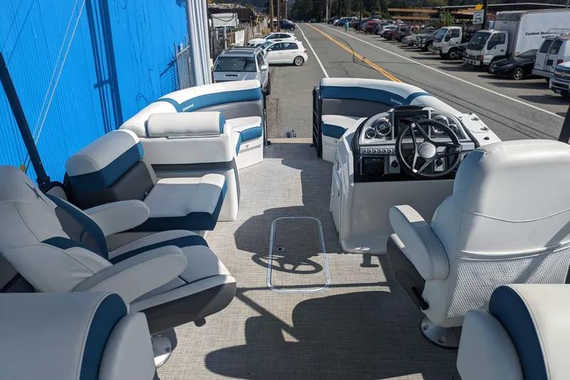 Slide: The Image of 2023 Berkshire 24RFX CTS pontoon boat interior with plush seating and modern dashboard. - 14
