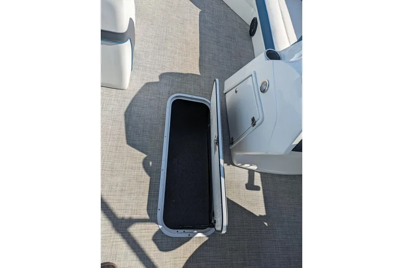 Slide: The Image of 2023 Berkshire 24RFX CTS boat interior with open storage compartment. - 17