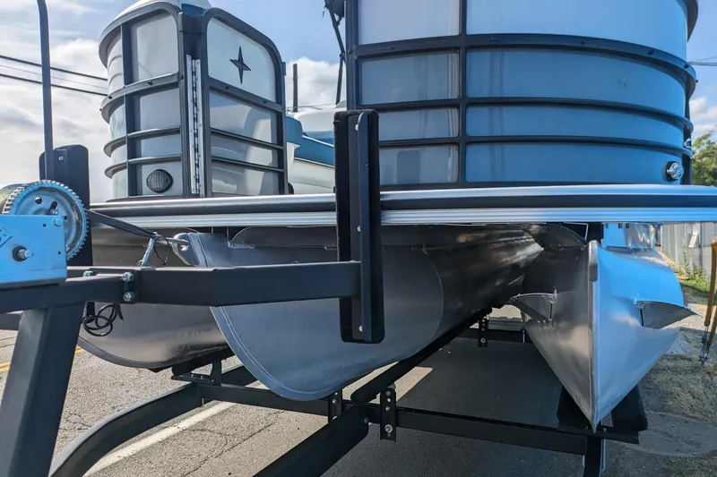 Slide: The Image of 2023 Berkshire 24RFX CTS pontoon boat on trailer, showcasing sleek design and sturdy construction. - 19