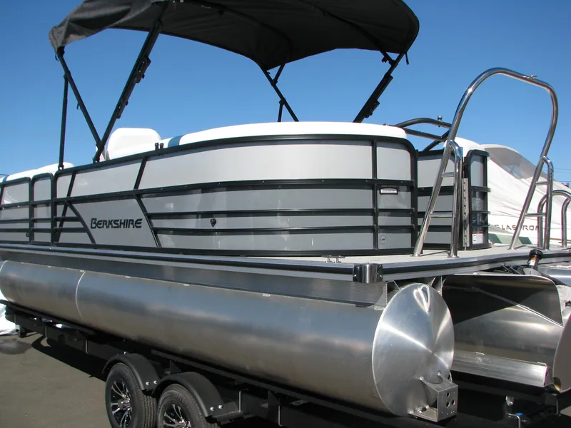 Slide: The Image of 2023 Berkshire 24RFX CTS pontoon boat with canopy on trailer. - 2
