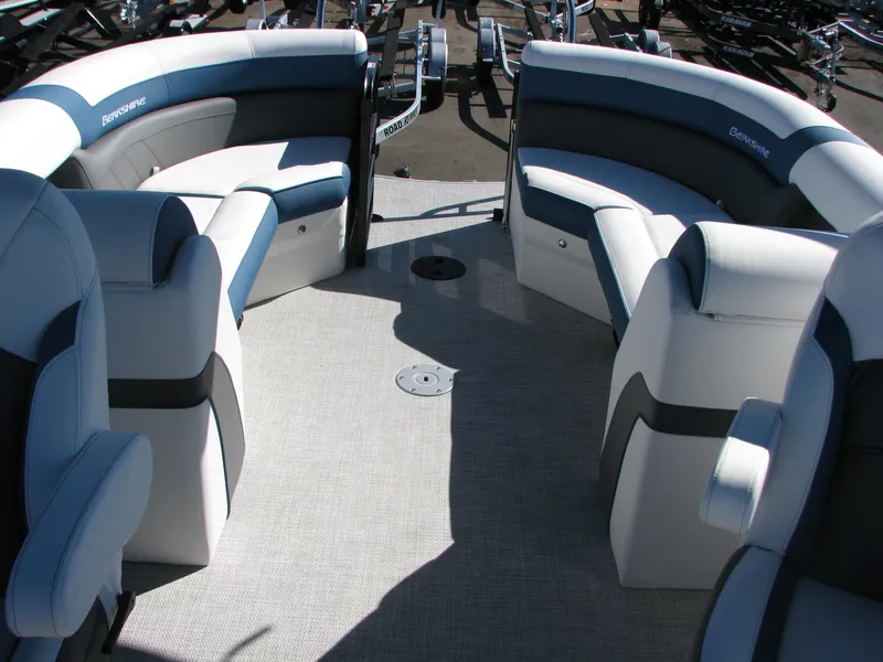 Slide: The Image of 2023 Berkshire 24RFX CTS boat interior with plush seating and modern design. - 9