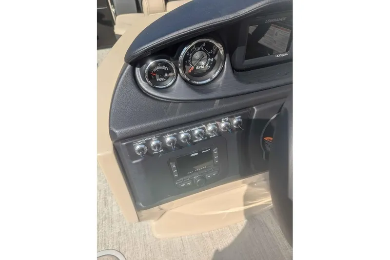 Slide: The Image of Dashboard of 2025 Berkshire 22RFX CTS boat with gauges and controls. - 11