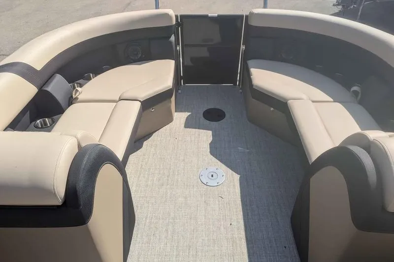 Slide: The Image of Interior of 2025 Berkshire 22RFX CTS pontoon boat with beige seating and carpeted floor. - 7