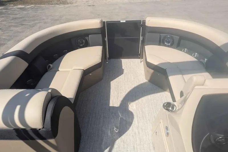 Slide: The Image of Interior of 2025 Berkshire 22RFX CTS pontoon boat with beige seating and modern design. - 8