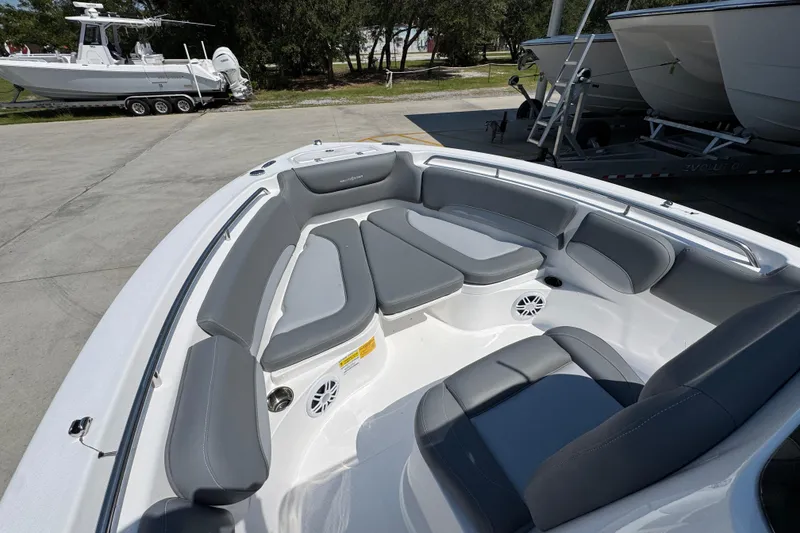 Slide: The Image of 2026 NauticStar 212 Legacy boat interior with gray seating and spacious layout. - 18