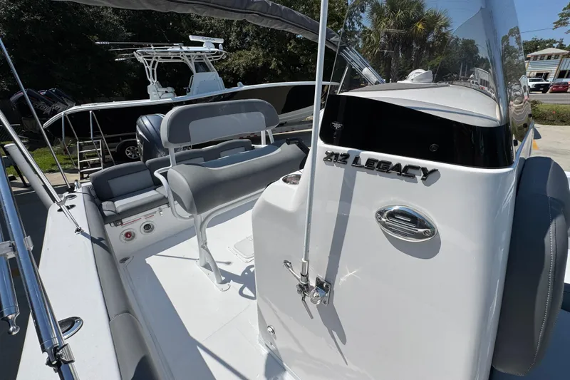Slide: The Image of 2026 NauticStar 212 Legacy boat interior with seating and console details. - 23