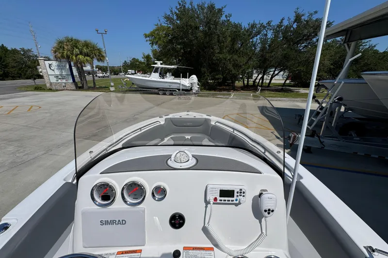 Slide: The Image of 2026 NauticStar 212 Legacy boat dashboard with gauges and navigation equipment. - 30